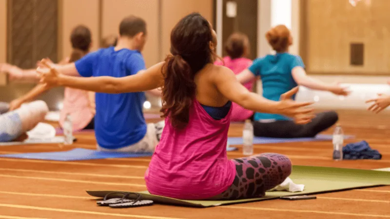 Corporate wellness group fitness session for employees led by a Fitserve trainer